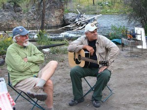 Musicians play around the fire on the shore of the Salmon River in Idaho